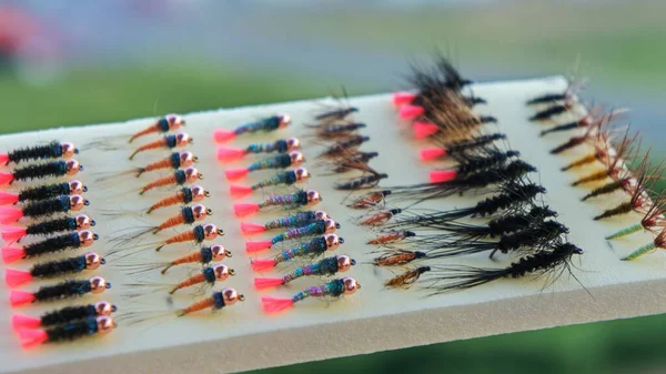 Flies for fly fishing. Fishing on an artificial fly. — Stok fotoğraf