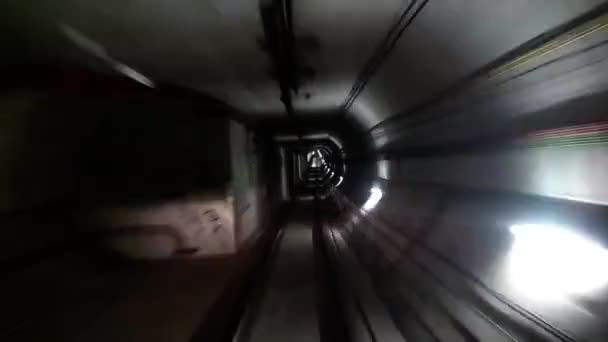 Fast underground train riding in a tunnel of the modern city — Stock Video