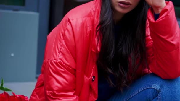 Fashion style portrait of young trendy girl sitting on a stairs — Stock Video