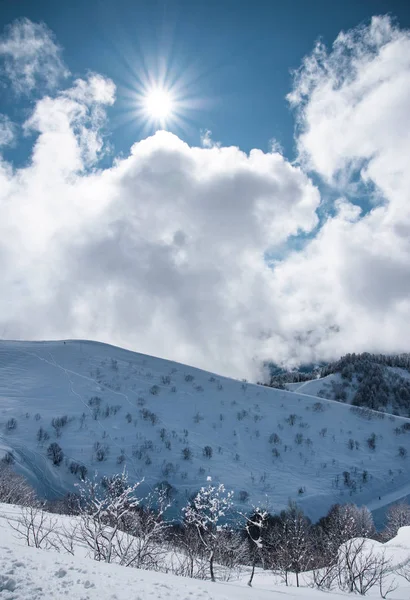 Mountain ski resort Rosa Khutor in Sochi.  Winter sunny day with cloudy — Stock Photo, Image