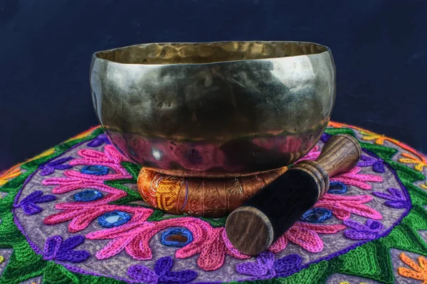 Tibetan handcrafted singing bowl on an Yoga Pillow