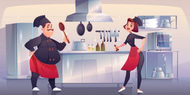 Şef ve aşçı yardımcısı mutfakta. Restoran personeli.