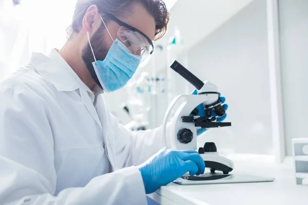 Modern Lab Smart Nice Handsome Scientist Sitting Front Microscope Looking — Stock Photo, Image