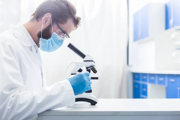 Interesting Job Serious Nice Intelligent Man Sitting Lab Looking Microscope — Stock Photo, Image