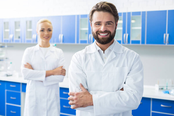 Cheerful bearded researcher smiling