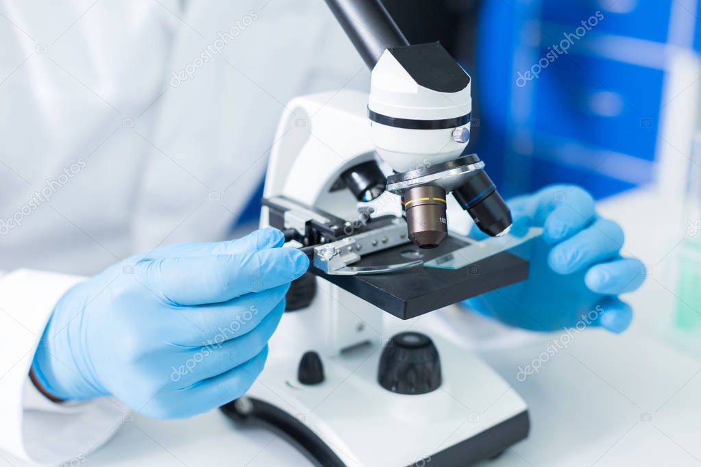 Scientific equipment. Selective focus of microscope being in use while studying the test samples