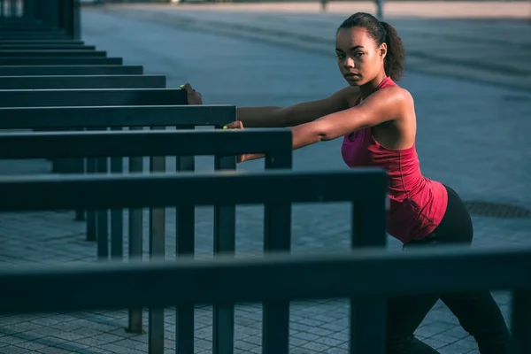 Calm Young Sportswoman Standing Outdoors Hands Banister Looking Away — Stock Photo, Image