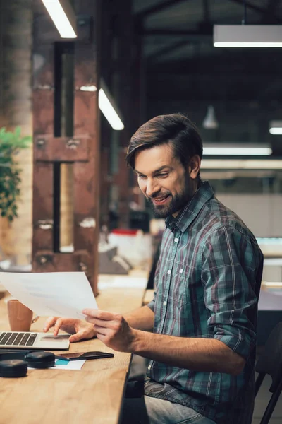 Cheerful Young Man Office Looking Sheet Paper Smiling — Stock Photo, Image