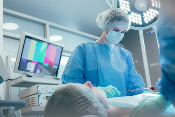 Patient Medical Couch Careful Surgeon Holding Bloody Cotton Wool Piece — Stock Photo, Image