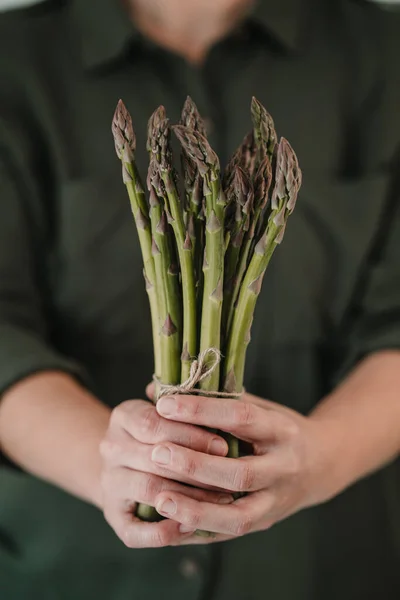 Asparagus. Fresh Asparagus. Green Asparagus. Asparagus in woman hands.