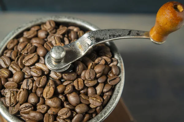 Coffee beans in a coffee grinder — Stock Photo, Image