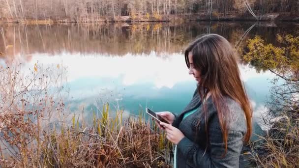 Girl Shore Beautiful Forest Lake Writes Social Network Chat Smartphone — Stock Video