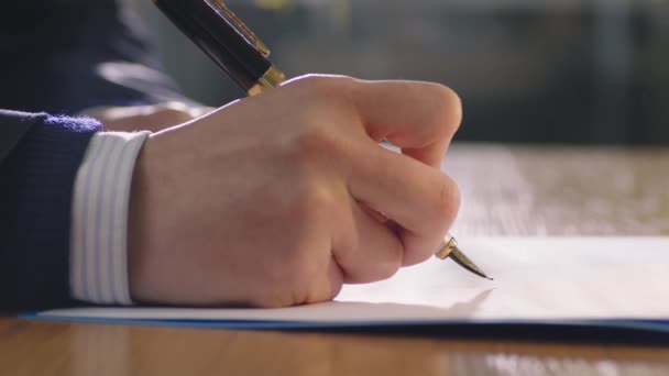 Closeup Hand Holding Pen Signing Document — Stockvideo