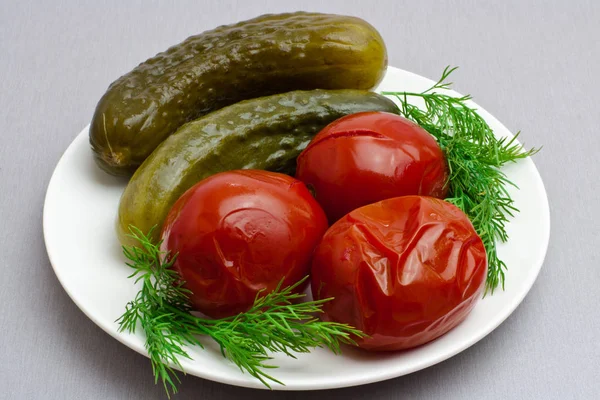 pickled cucumbers and tomatoes with greens