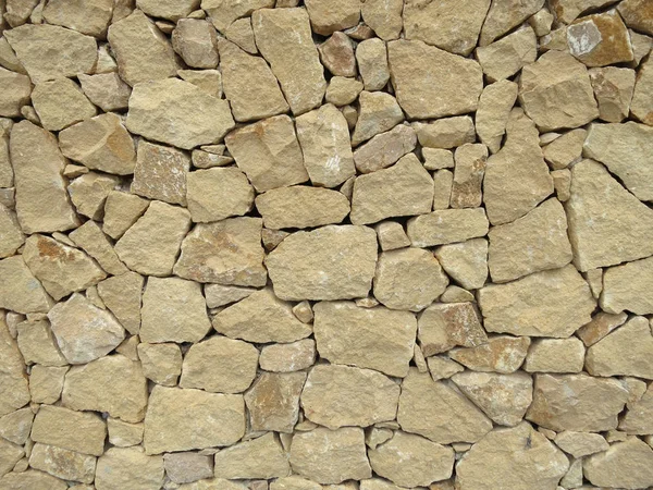 Ocre stone rock wall — Stock Photo, Image
