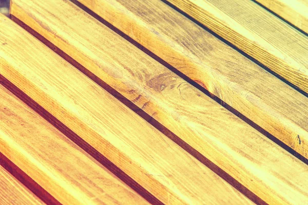 Texture, pattern, background. Wooden slats. a thin, narrow piece of wood, especially one of a series that overlap or fit into each other, as in a fence or a Venetian blind.