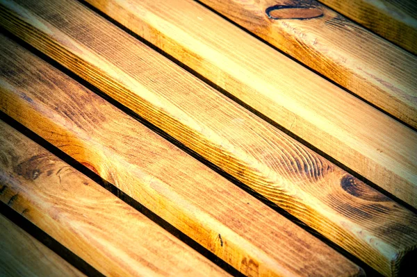 Texture, pattern, background. Wooden slats. a thin, narrow piece of wood, especially one of a series that overlap or fit into each other, as in a fence or a Venetian blind.