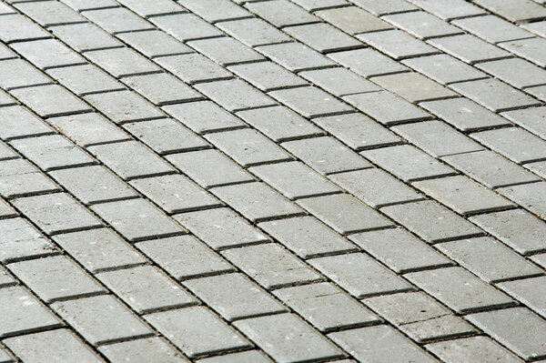 Texture, background. The sidewalk on the waterfront of the river Melekeska