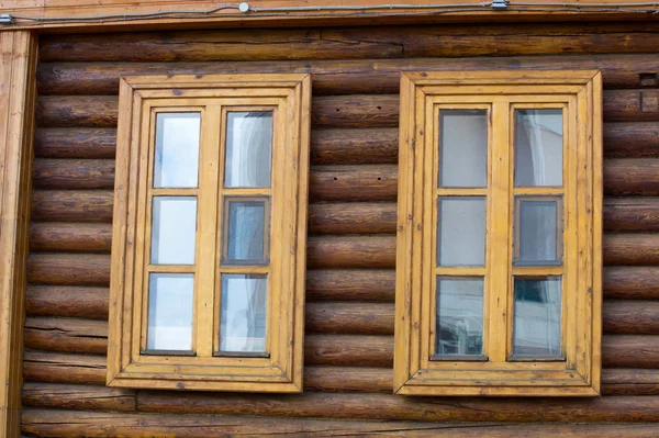 Texture, background. wooden windows, wooden house, house made of logs, log