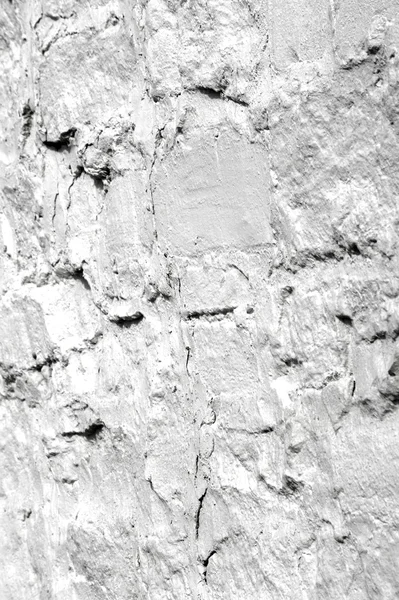 Het patroon, achtergrond. een muur bekleed met steen, witgekalkte — Stockfoto