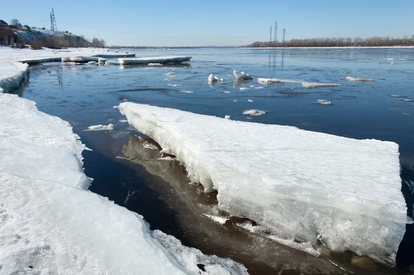 River With Broken Ice. energy pillars.  ice hummocks on the river in spring. landscape close-up ice drift on the river in the spring on a sunny day