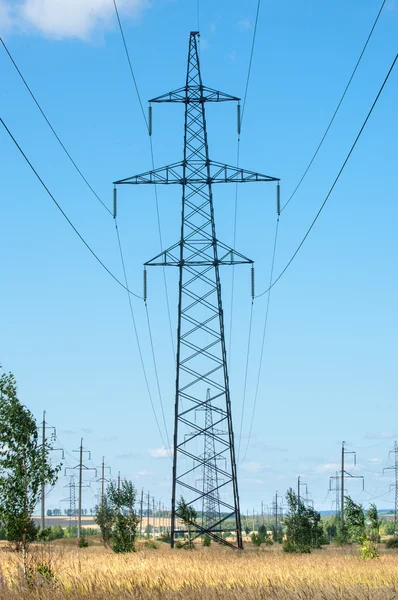 energy poles. high voltage post. High-voltage tower sky background. hrough a mast of a high voltage cable for electricity,