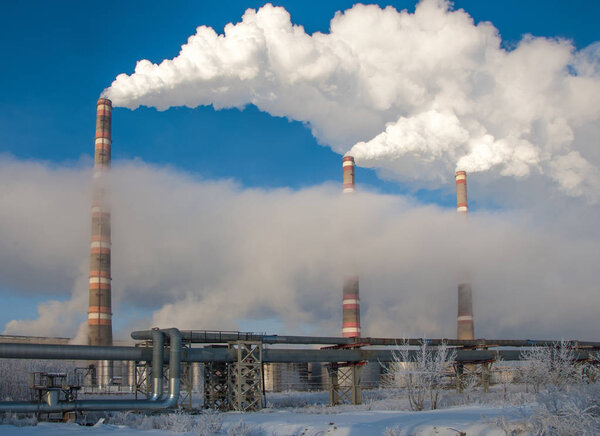 Pipe with smoke. Heat energy network. CHP. combined heat and pow