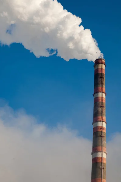 Pipe with smoke. Heat energy network. CHP. combined heat and power, a system in which steam produced in a power station as a byproduct of electricity generation is used to heat nearby buildings.