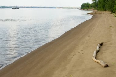 Doku, arka plan. kum plaj. gevşek taneli madde, soluk sarımsı kahverengi, silisli ve diğer kayalar erozyon kaynaklanan ve plajları büyük bir kurucu şekillendirme,