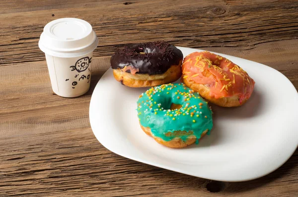 Texture, background, two donuts and coffee. Donuts covered with — Stock Photo, Image