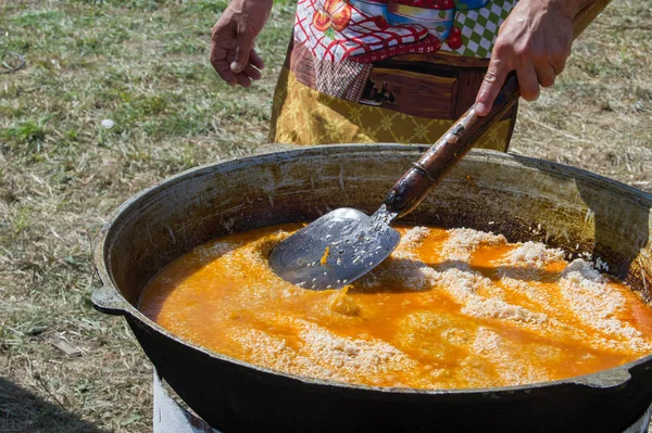 Uzbek national dish pilaf. a Middle Eastern or Indian dish of rice (or sometimes wheat) cooked in stock with spices, typically having added meat or vegetables.