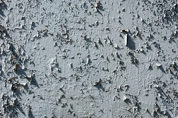 Texture of old paint. Old paint is chipping on the weather conditions