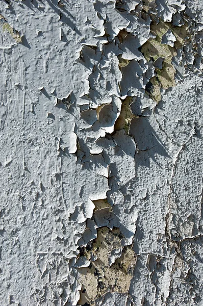 Texture of old paint. Old paint is chipping on the weather conditions