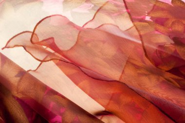 Pembe kumaş çiçek işlemeli. doku. Stüdyo fotoğrafı