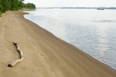 Doku, arka plan. kum plaj. gevşek taneli madde, soluk sarımsı kahverengi, silisli ve diğer kayalar erozyon kaynaklanan ve plajları büyük bir kurucu şekillendirme,