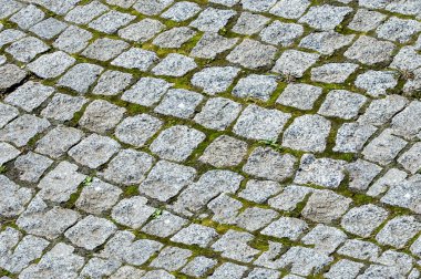 Sorunsuz doku, arka plan. Granit kaldırım. Döşeli veya kaplı asfalt karayolu sokak.