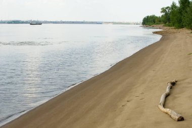 Doku, arka plan. kum plaj. gevşek taneli madde, soluk sarımsı kahverengi, silisli ve diğer kayalar erozyon kaynaklanan ve plajları büyük bir kurucu şekillendirme,
