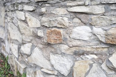 Doku, arka plan, desen. Doğal taş duvara sıraya dizdik. Hard rock parçalar ya da solid kitle, hem de bir parça, Bina bina dikey parçası.