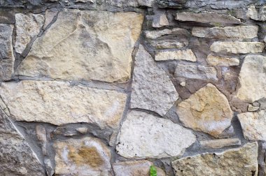 Doku, arka plan, desen. Doğal taş duvara sıraya dizdik. Hard rock parçalar ya da solid kitle, hem de bir parça, Bina bina dikey parçası.