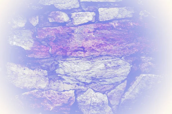 Texture, background, pattern. Natural stone lined wall. Hard rock chunks or solid mass, as well as a piece, vertical part of the building premises.