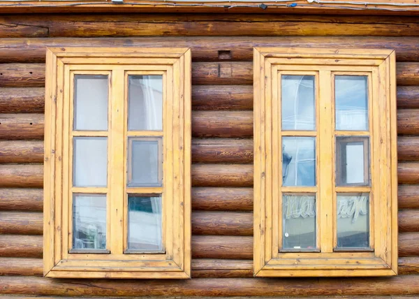 Texture, background. wooden windows, wooden house, house made of logs, log