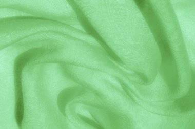 Doku, arka plan, desen. Kumaş - ipek ışık. Soluk yeşil kumaş. Güzel resim. Vintage soluk kumaş, astar için uygun. Polyester. Çok uçuk yeşil veya doğru renk tuşları ile kekler için.