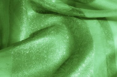 Doku, arka plan, desen. Kumaş - ipek ışık. Soluk yeşil kumaş. Güzel resim. Vintage soluk kumaş, astar için uygun. Polyester. Çok uçuk yeşil veya doğru renk tuşları ile kekler için.