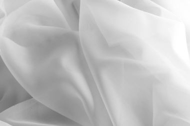 Doku, arka plan, desen. İpek kumaş şeffaf, beyaz renkte. Soyut yumuşak şifon doku arka plan. Eğri ve dalga ile yumuşak beyaz şifon