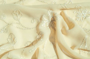 Doku, arka plan, desen. Kadın renk şal. Altın Başak. Limon kremalı. Navajo beyazdır. Eski altın. ipek kumaş.