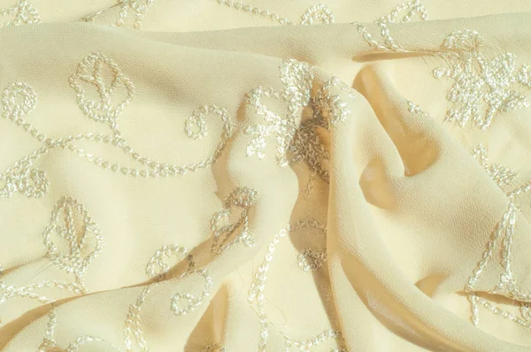 Doku, arka plan, desen. Kadın renk şal. Altın Başak. Limon kremalı. Navajo beyazdır. Eski altın. ipek kumaş.