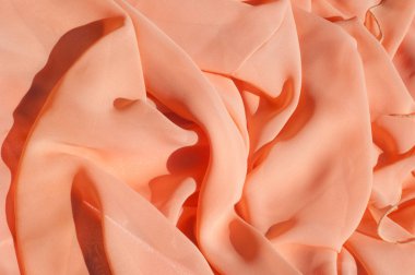 Doku, arka plan, desen. Açık turuncu renkli, ipek topu cüppe elbise. Kumaş mercan ipek