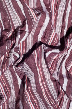 Doku, arka plan, desen. Erkek atkı, çizgili kumaş kahverengi, beyaz, parlak kırmızı çizgili