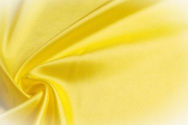 Doku arka plan deseni. İpek kumaş, sarı kumaş. Siyah bir arka plan üzerinde. Çiçek Tekstil veya kumaş. Kumaş dokusuna. Kumaş, tekstil, kumaş, dokuma malzeme,.