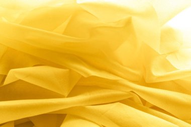 Doku, arka plan, desen. İpek kumaş dokusuna sarıdır. İpek kumaş şeffaf.